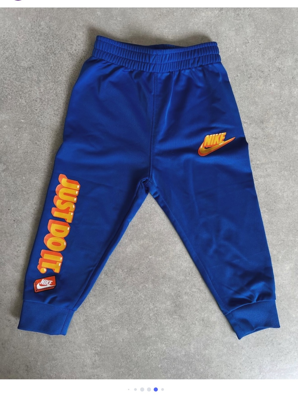 Nike Kids Royal Blue Joggers with Orange 'Just Do It' Graphics